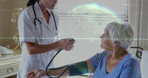 Home Care Nurse Checking Blood Pressure of Senior Patient