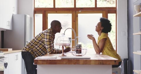African American Couple Enjoying Coffee at Home Sunlit Kitchen - Download Free Stock Images Pikwizard.com