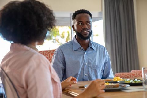 Couple Enjoying Breakfast Conversation at Home