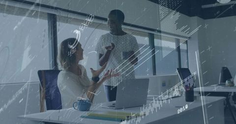 Two Women Collaborating in Office Environment with Digital Overlay