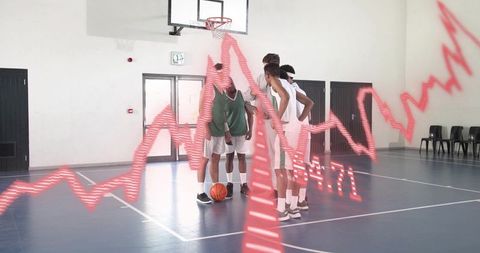 Basketball team huddling with red performance overlay on indoor court for analytics