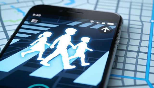 Smartphone displaying pedestrian family crossing on digital map for navigation safety