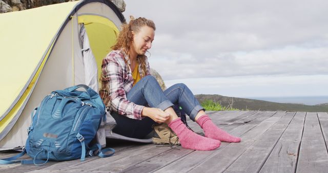 Young Woman Preparing for Hike Next to Camping Tent - Download Free Stock Images Pikwizard.com