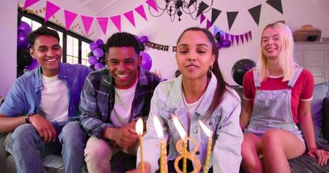 Diverse Friends Celebrating 18th Birthday with Cake and Candles