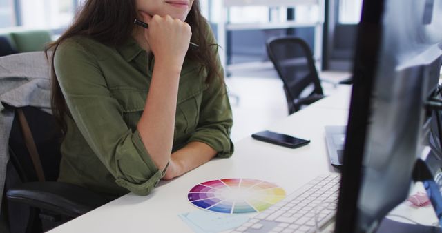 Graphic Designer Working with Color Wheel at Desk - Download Free Stock Photos Pikwizard.com