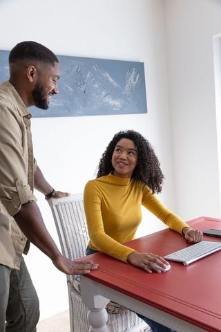 Diverse professionals collaborating in bright home office