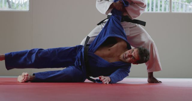 Two Martial Artists Practicing Judo Techniques - Download Free Stock Images Pikwizard.com