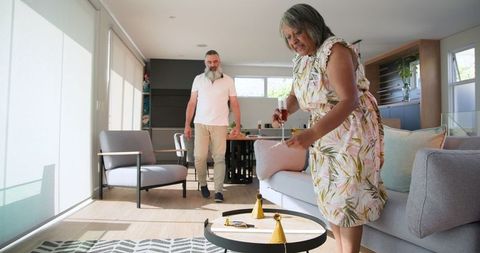 Senior Couple Enjoying Meal Preparation in Bright Home Kitchen
