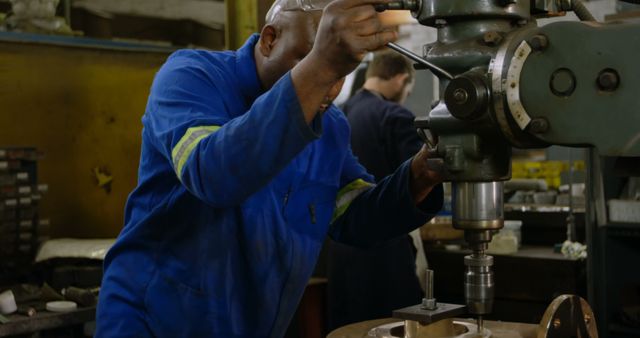 Engineer Operating Heavy Machine in Industrial Workshop - Download Free Stock Images Pikwizard.com