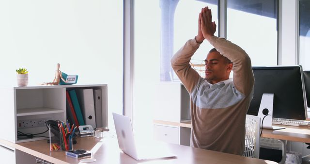 Young Professional Meditating at Office Desk - Download Free Stock Images Pikwizard.com