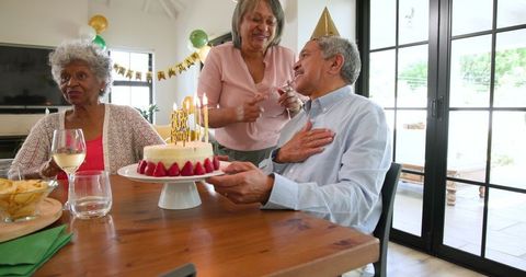 Elderly Friends Celebrating Birthday at Home