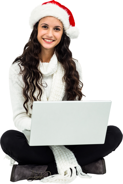 Smiling woman wearing Santa hat using laptop on transparent background - Download Free Stock Videos Pikwizard.com