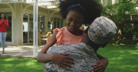 Joyful Reunion of Soldier with Daughter Outdoors - Download Free Stock Images Pikwizard.com