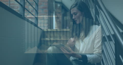 Businesswoman Analyzing Data on Stairs with Graphs Overlay