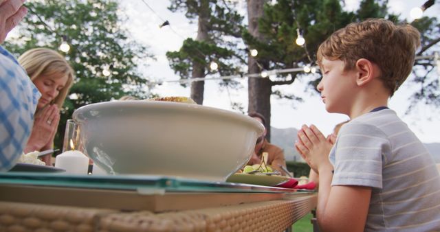 Family Praying Before Dinner at Outdoor Table - Download Free Stock Images Pikwizard.com