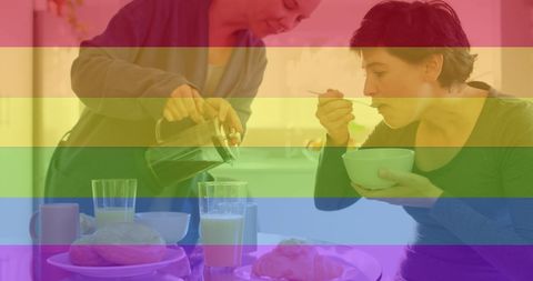 Lesbian Couple Enjoying Breakfast With LGBTQ Pride Overlay