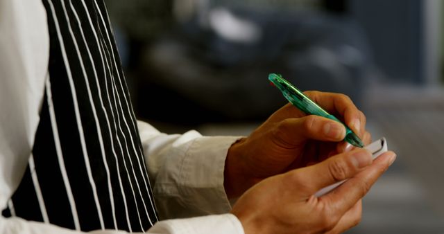 Waiter Taking Order in Restaurant with Green Pen - Download Free Stock Images Pikwizard.com