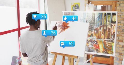 Male Artist Painting in Studio with Social Media Engagement