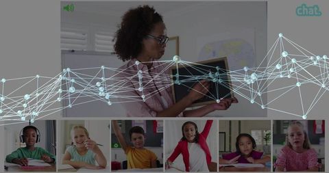 Teacher teaching remotely, pointing at slate with network overlay and virtual students