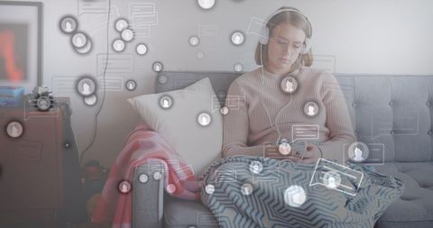 Caucasian Woman Using Smartphone at Home with Social Media Icons