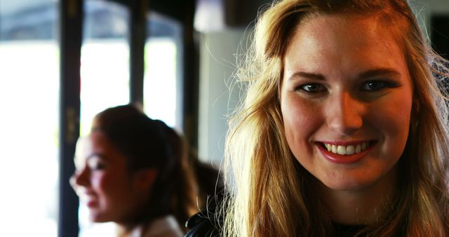 Smiling Woman with Blonde Hair in Bright Room - Download Free Stock Images Pikwizard.com