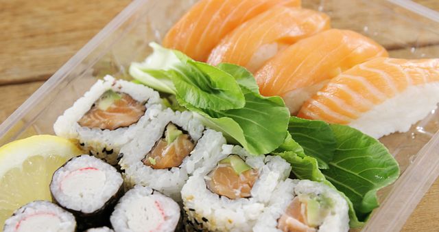 Close-up of Fresh Sushi Rolls and Nigiri in Takeaway Container - Download Free Stock Images Pikwizard.com