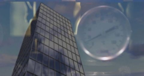 Soaring glass skyscraper with gauge overlay, cloud reflections and urban double exposure