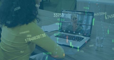 Businesswoman on video call with financial data overlay