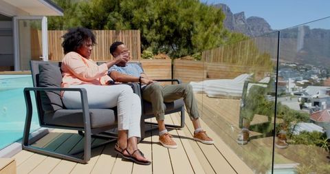 Couple enjoying scenic view from modern patio