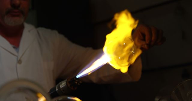 Glassblower Shaping Molten Glass with Blowtorch - Download Free Stock Images Pikwizard.com