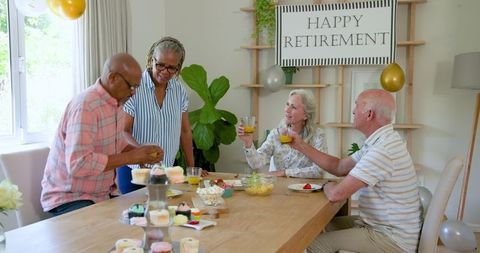 Senior Friends Celebrating Retirement Party With Smiles and Laughter