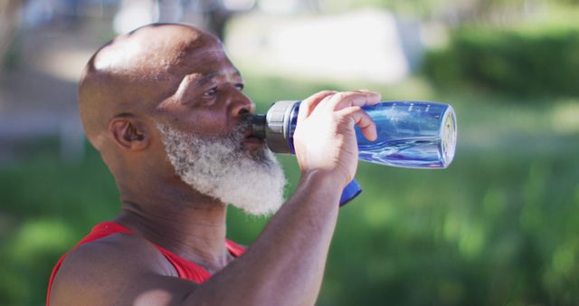 Senior Man Drinking Water Outdoors Post-Workout - Download Free Stock Images Pikwizard.com