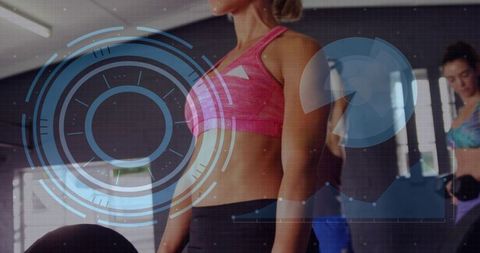 Fit woman training with weights in gym wearing bright pink sports bra with HUD overlay