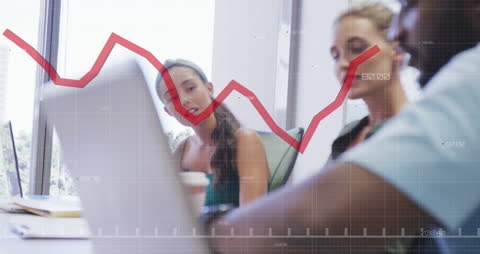 Colleagues Analyzing Data with Graph Overlay in Modern Office