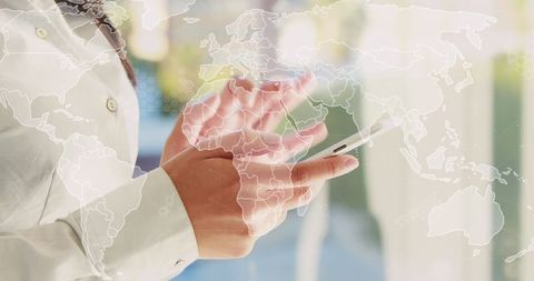 Businesswoman utilizing smartphone for global communication