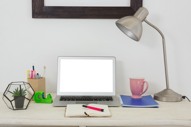 Transparent Screen Laptop with Office Supplies on Desk - Download Free Stock Videos Pikwizard.com