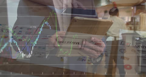 Businessman Analyzing Market Trends on Tablet Overlay with Data Graphs