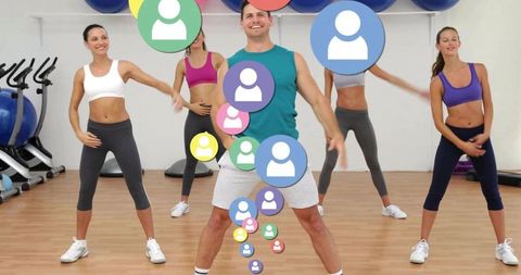 Male instructor leading high-energy group aerobics class with social avatar overlay