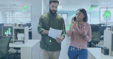 Coworkers Analyzing Digital Data on Move in Modern Office