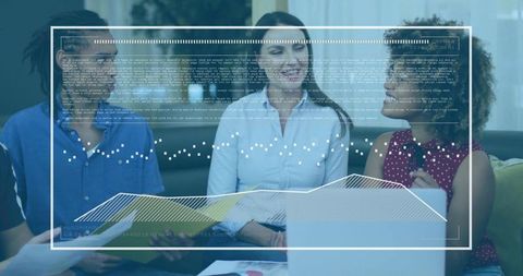 Team Collaborating in Lounge Analyzing Data and Charts on Laptop