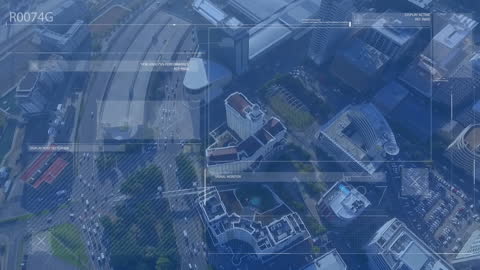 Aerial View of Futuristic Digital Interface Over Cityscape