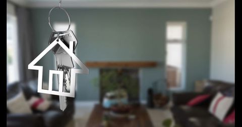 House-Shaped Keychain in Modern Living Room Illustrating New Home Concept