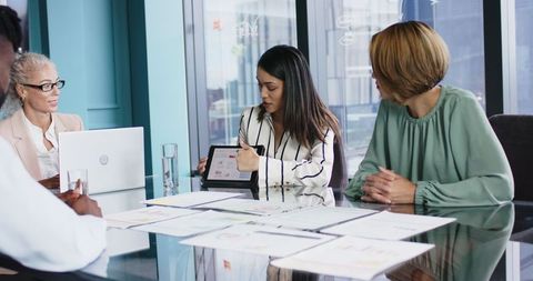 Women Executives Collaborating in Modern Conference Room