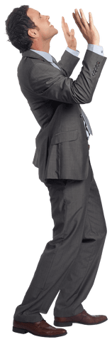 Businessman demonstrating confidence and determination with arms raised, ideal for presentations, corporate materials or motivational themes focusing on success and hard work.