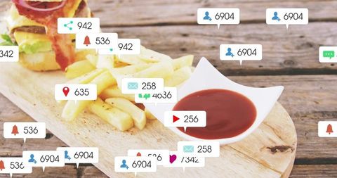 Social media notification overlays on rustic burger and fries platter with ketchup dip
