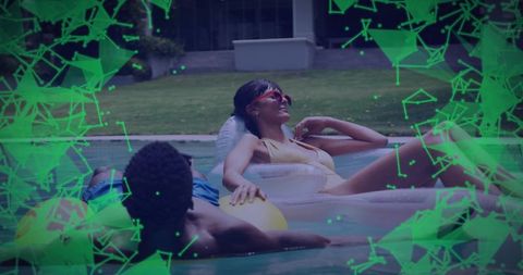 Couple relaxing on pool floats with digital overlay