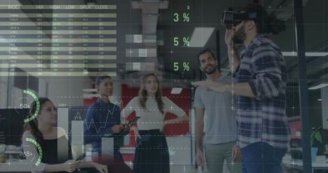 Innovative team collaborating with vr in modern office