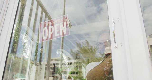 Retail Storefront with Open Sign Hanging on Glass Door - Download Free Stock Images Pikwizard.com