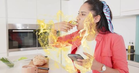 Woman Eating Wrap in Contemporary Kitchen with Sparkle Effect