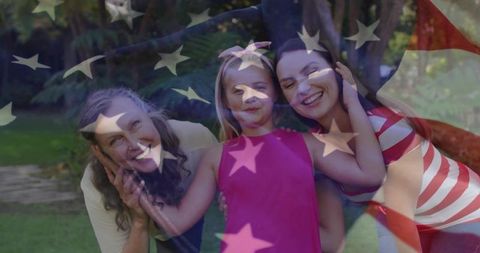 Multigenerational family smiling in backyard with american flag overlay